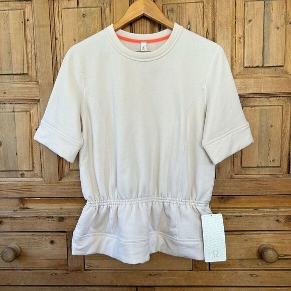 Lululemon Size 8 Peplum‎ Pullover Blush Pale Pink Short Sleeve Sweater Top NWT - Picture 1 of 8